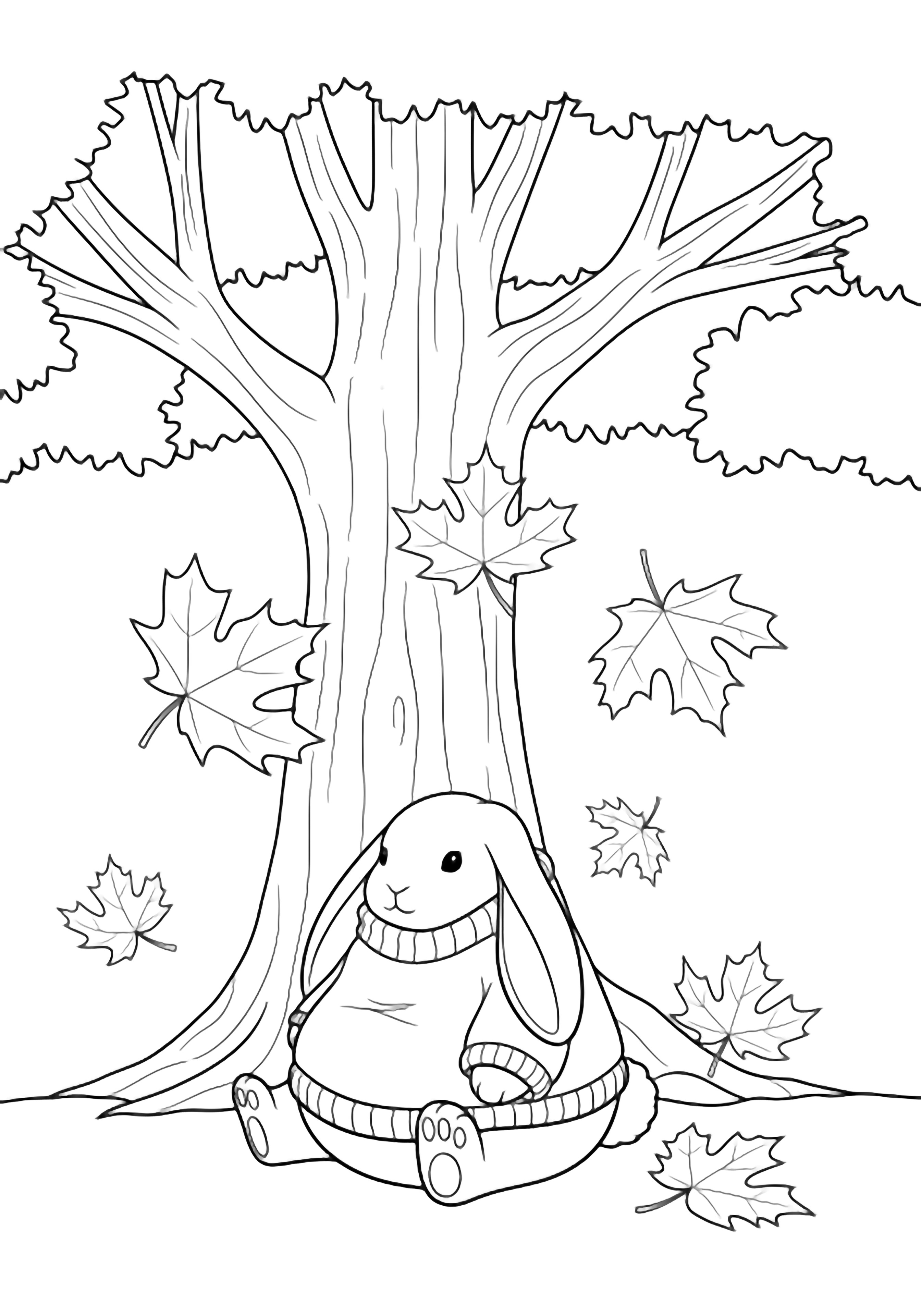 A plump bunny wearing an oversized floppy sweater sits contentedly beneath a wide maple tree while large simple leaves drift around it. kleurplaat